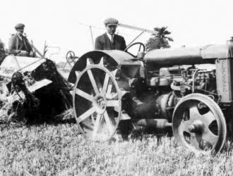 One of the first tractors used for cutting corn with a binder.